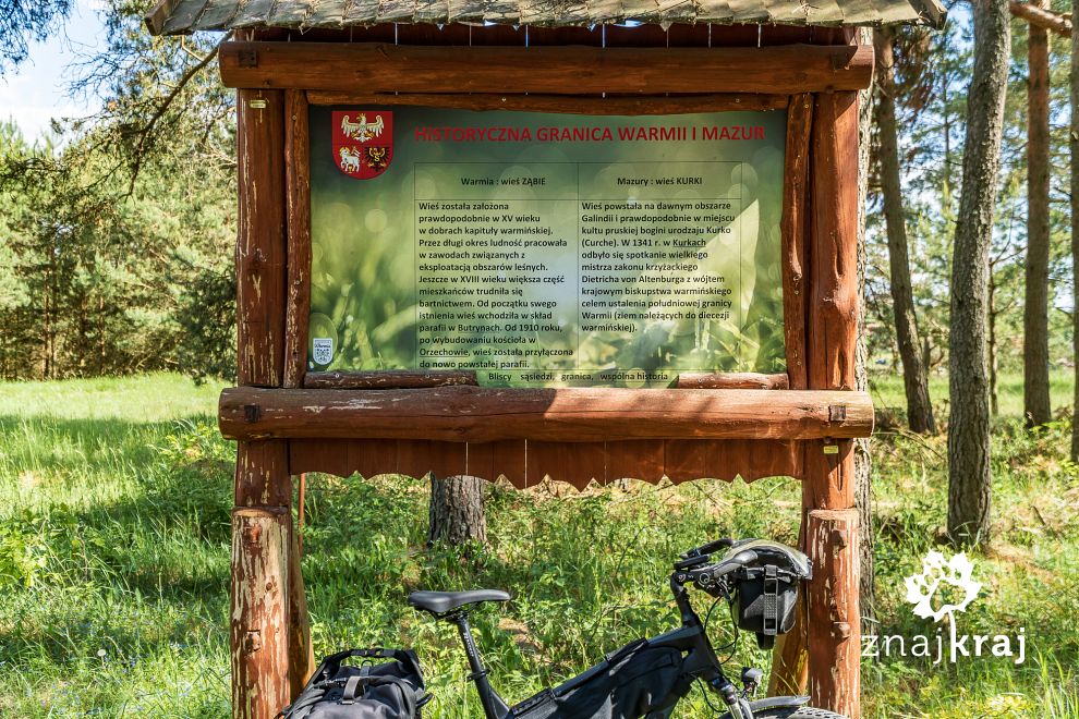 Tablica informacyjna na granicy Warmii i Mazur
